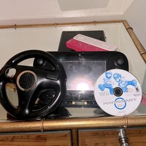 Nintendo Wii U in black. In fair condition with all necessary cables included :)